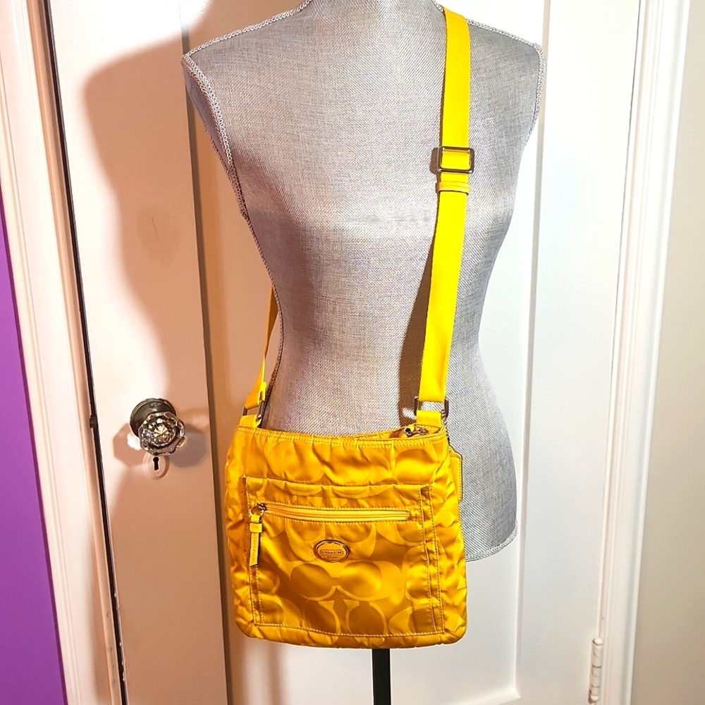 Coach cross body bag. Yellow medium sized
